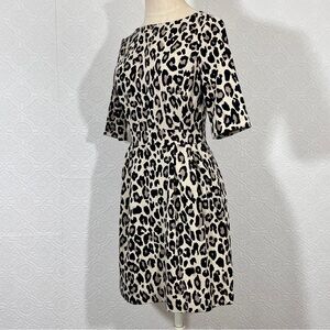 Kate spade leopard print mini dress 
Back zip closure, prayed accent